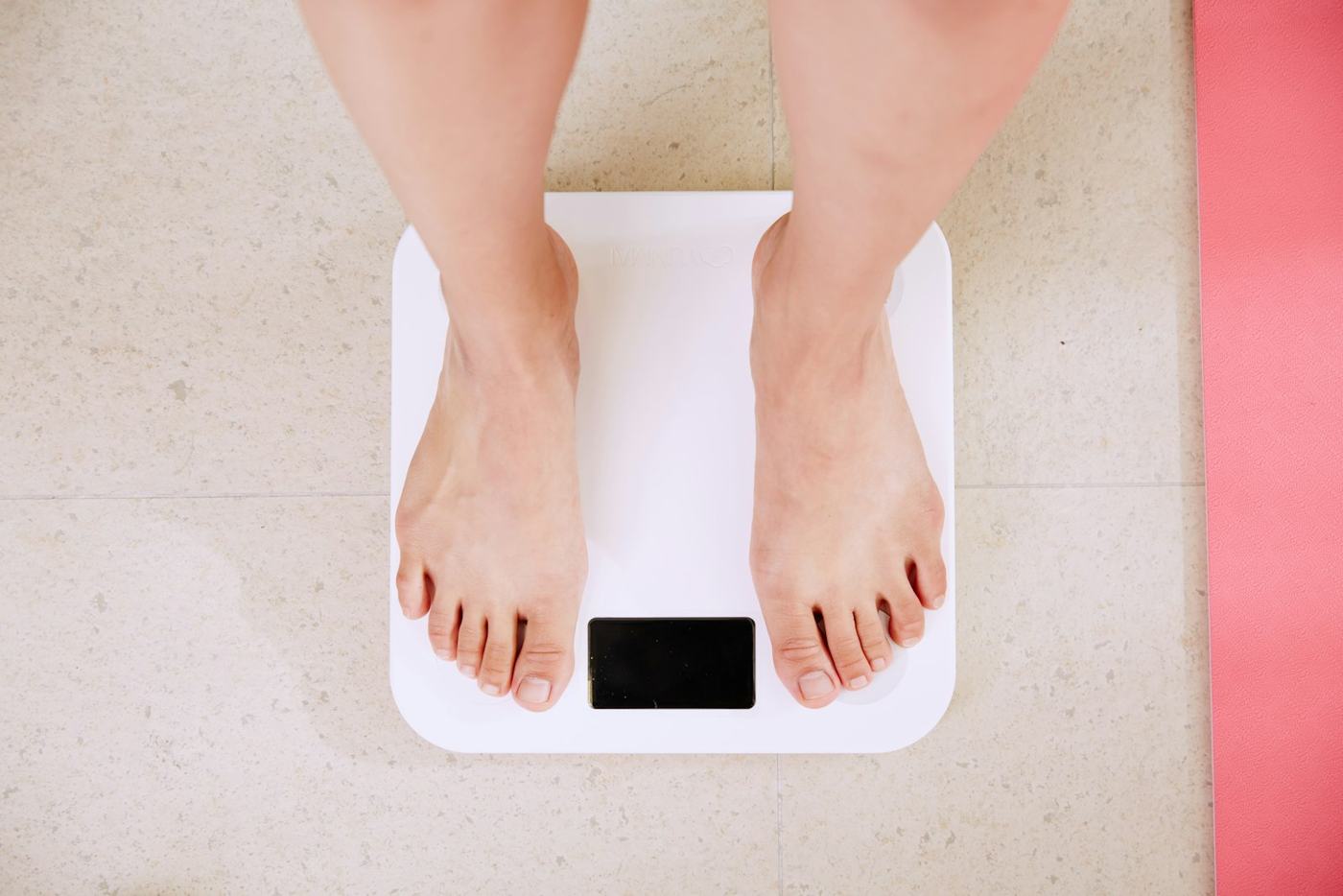 Bare feet on a bathroom scale before a weigh-in